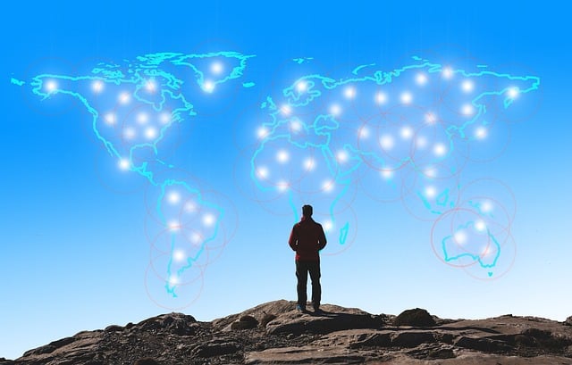 Man monitoring virtual network across world map