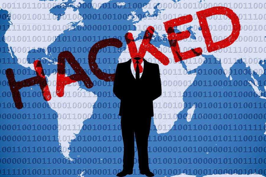 Illustration of world map overlaid with binary and a "hacked" stamp